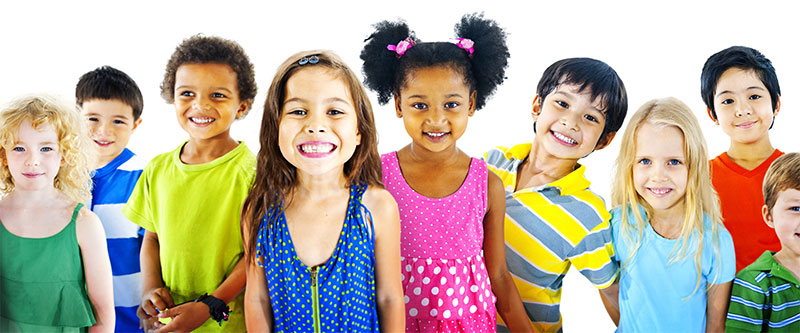 The image depicts a diverse group of children and adults, possibly in an educational or recreational setting, with smiling faces looking at the camera.